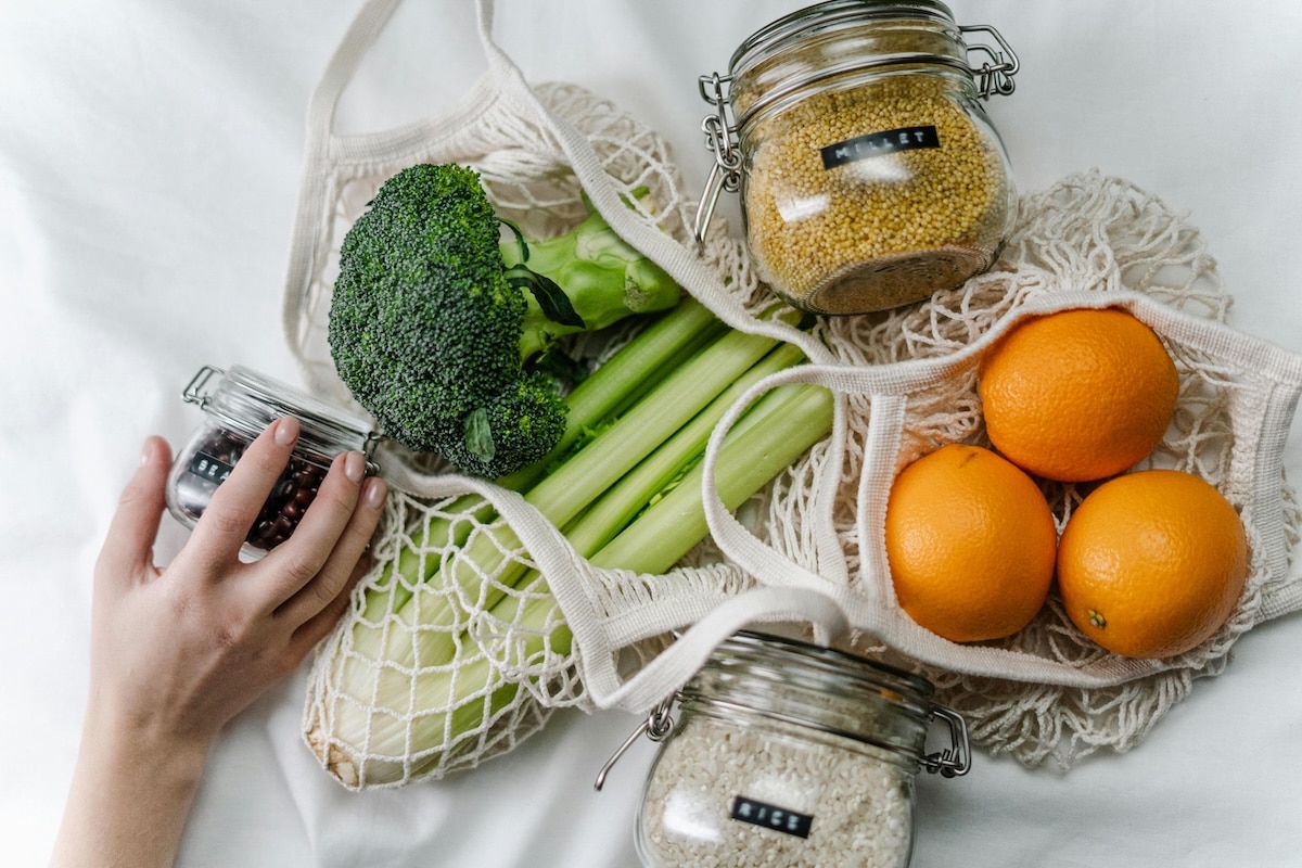 Fresh vegetables and gluten-free grains laid out together, illustrating a balanced diet for managing PCOS.