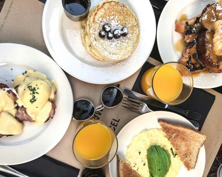 Birds eye view of a table with variety of breakfast foods on them