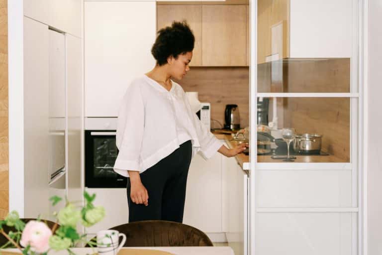 Pregnant women in a kitchen making a meal
